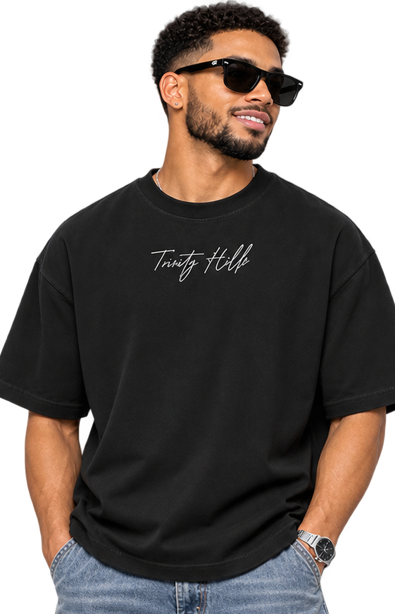 Port of Spain Boxy Tee male model front view in washed jeans
